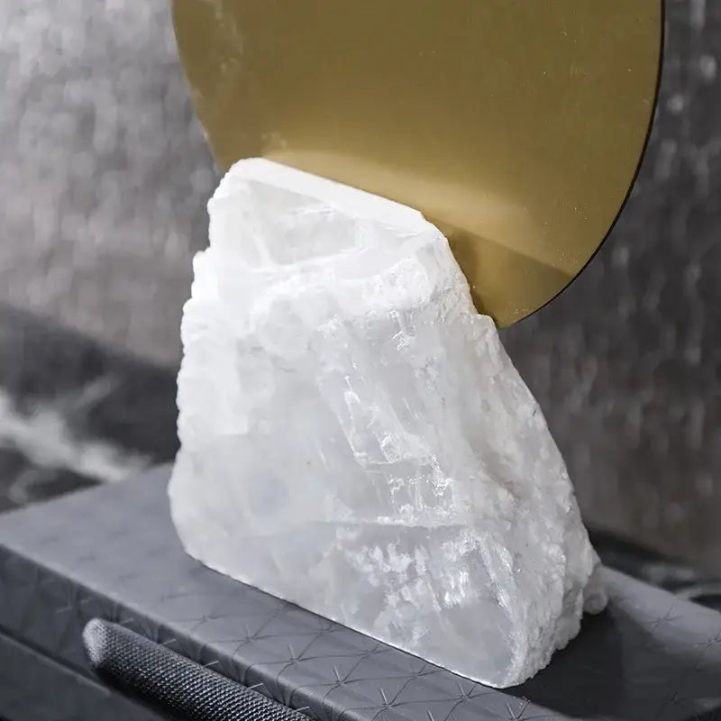 A translucent white crystal geometric metal sculpture bookend with rough texture and jagged edges for modern decorbites decor