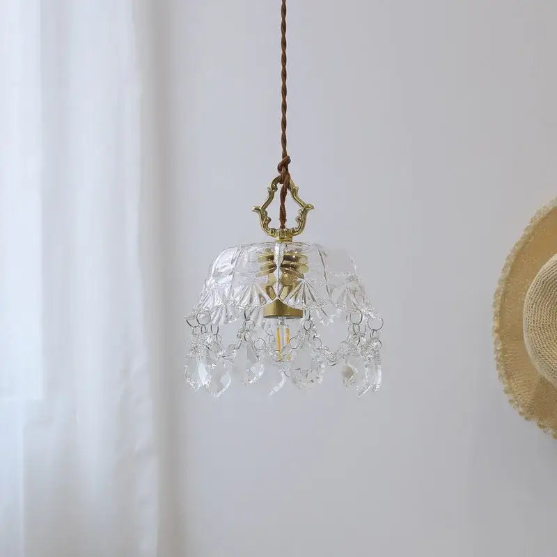 Modern crystal glass led pendant lamp with clear glass chandelier, intricate cut patterns, and brass dining room fixture