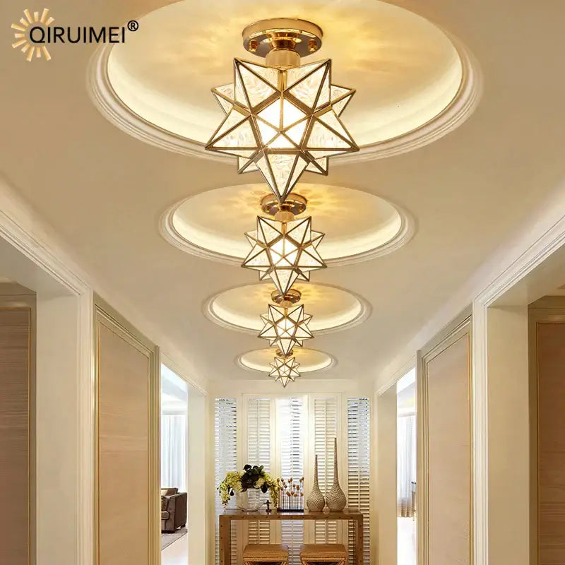 Modern gold-toned star-shaped ceiling light fixture with geometric crystal glass panels for decorbites crystal glass nordic decor