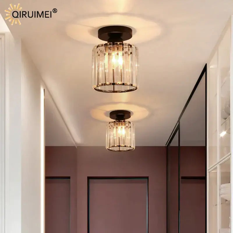 Two black modern crystal glass nordic led ceiling lights with cylindrical crystal cages for dining room decorbites