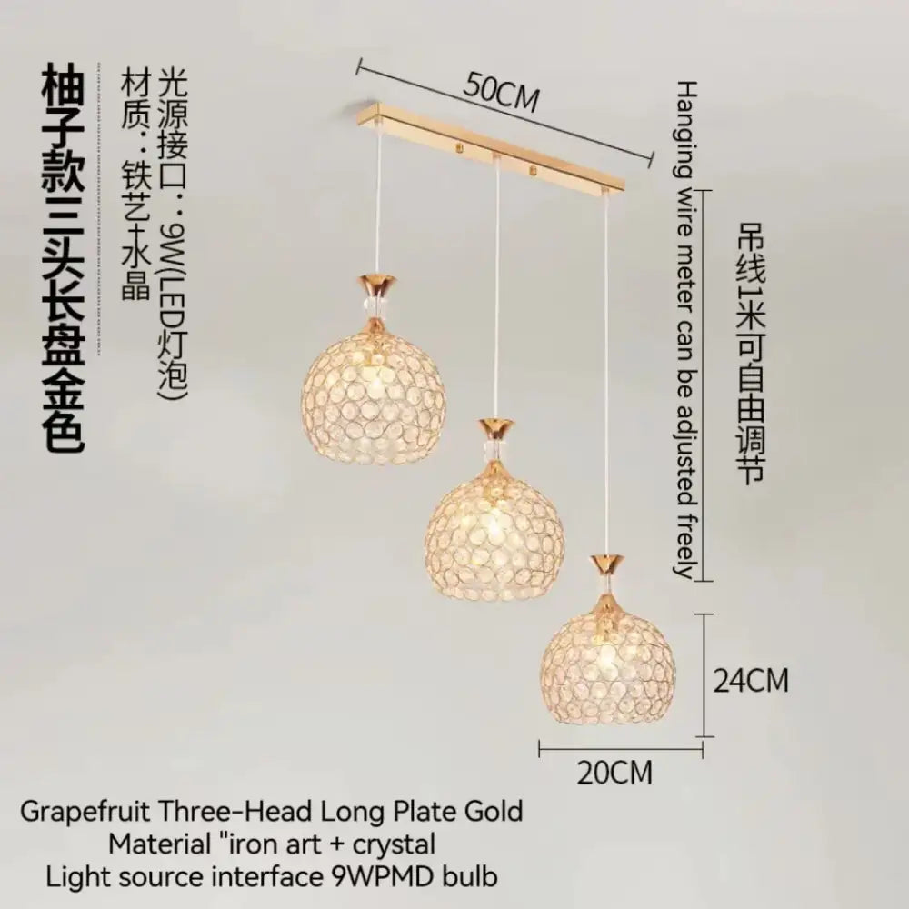 Modern crystal gold ceiling chandelier featuring gold-colored grapefruit pendant lights with crystal mesh on iron art bar