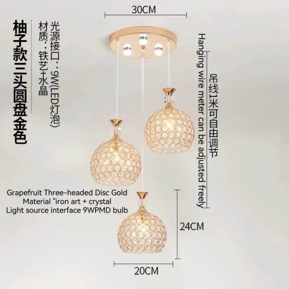 Modern crystal gold ceiling chandelier featuring gold-colored grapefruit-shaped three-headed iron art and crystal design with 9w pmd bulb