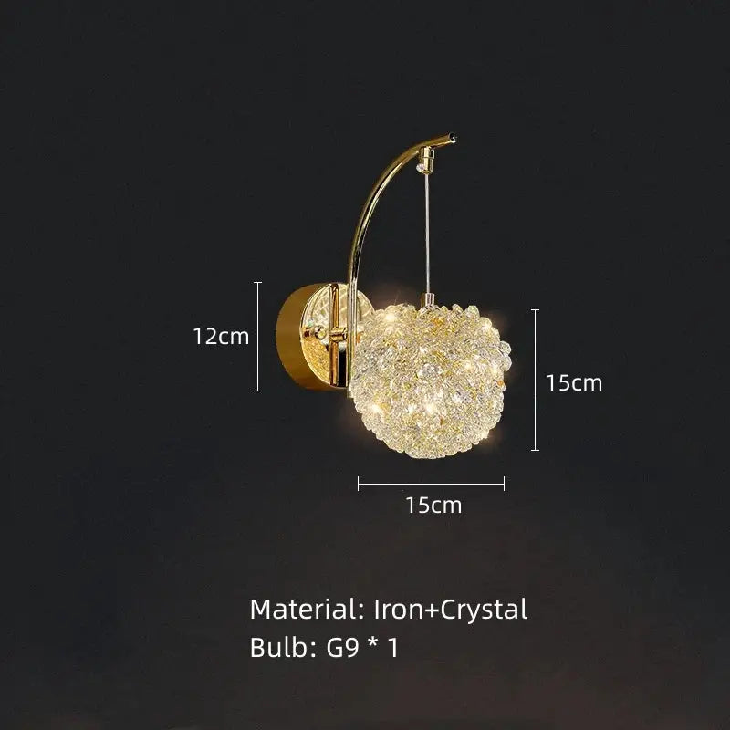 Gold-toned wall sconce with a spherical crystal cluster hanging from an arched iron arm for crystal gold ceiling decorbites ceiling light