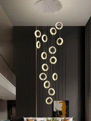 Modern crystal gold led chandelier featuring glowing gold rings in a circular pendant design for dining room decorbites crystal gold
