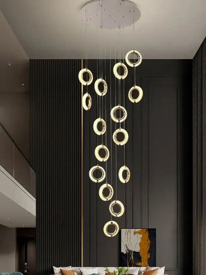 Modern crystal gold led chandelier featuring glowing gold rings in a circular pendant design for dining room decorbites crystal gold