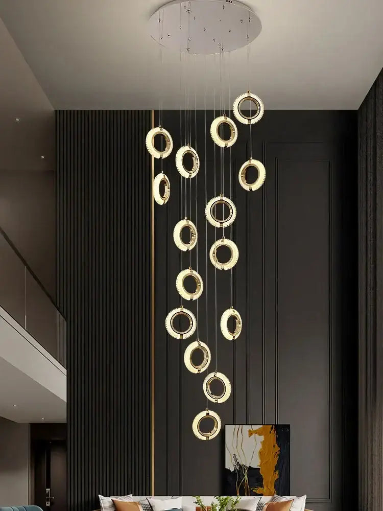 Modern crystal gold led chandelier featuring glowing gold rings in a circular pendant design for dining room decorbites crystal gold
