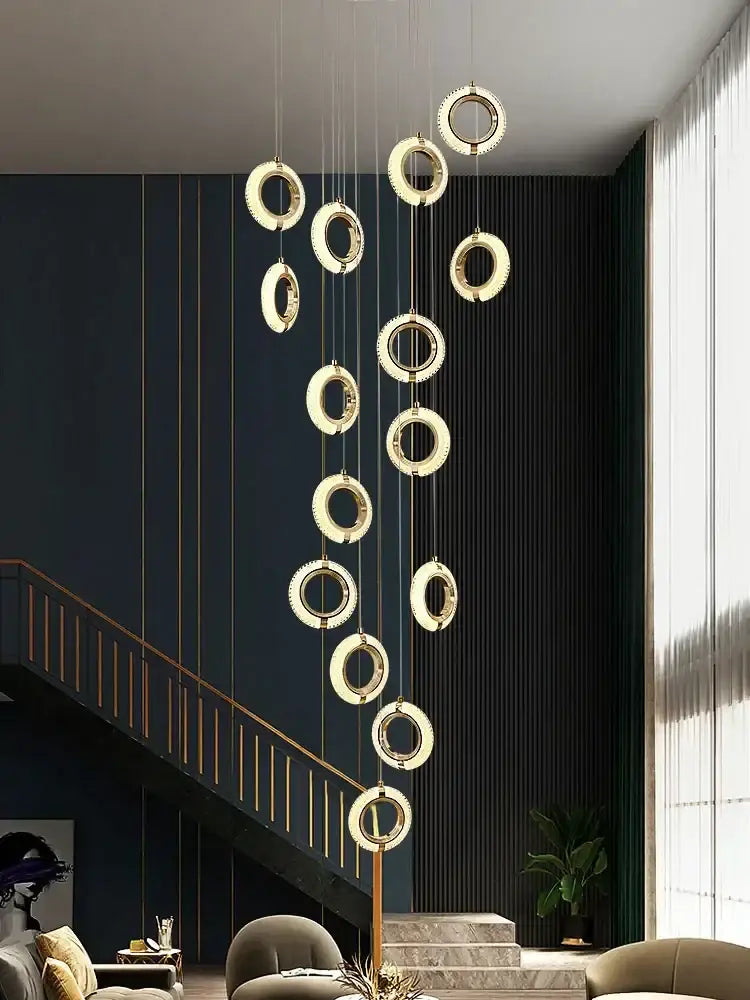 Modern crystal gold led chandelier featuring cascading gold-toned circular rings for dining room decorbites crystal gold lighting