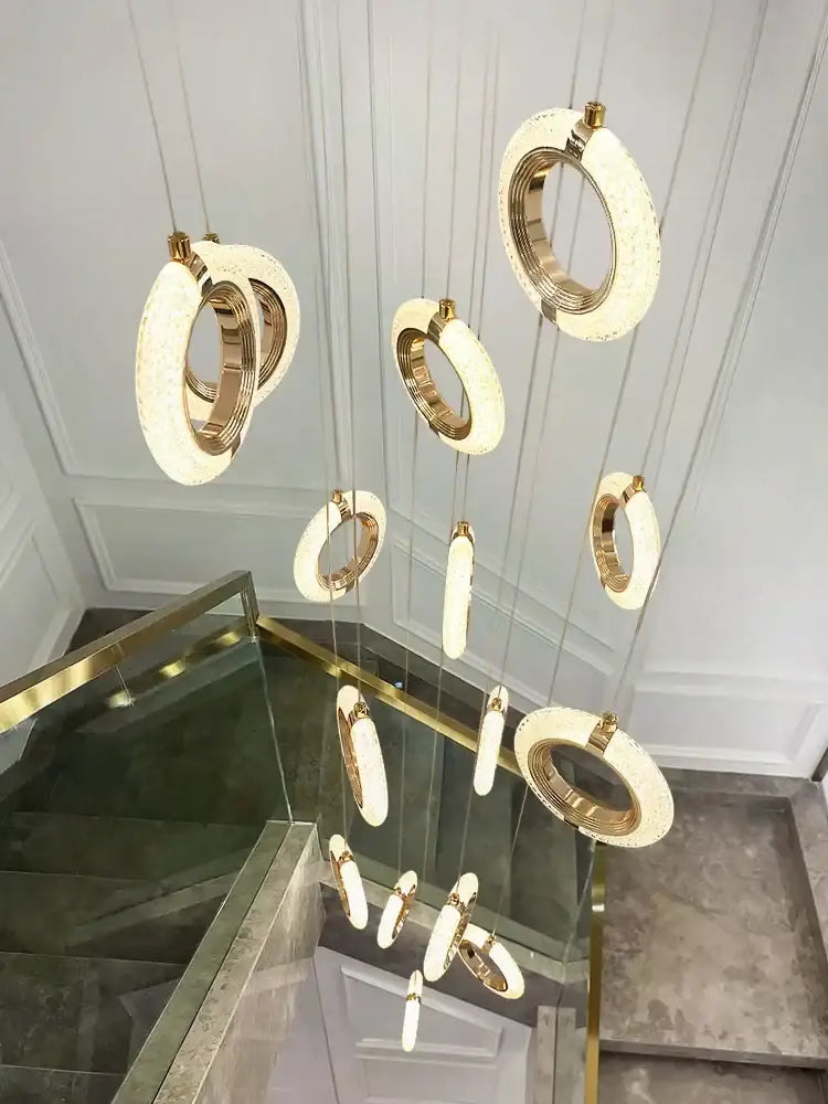 Modern crystal gold led chandelier with gold-toned circular pendant lights and frosted glass accents for dining room decorbites crystal gold