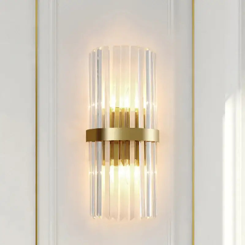 Modern crystal gold led wall sconce with vertical clear glass rods and central brass ring for elegant decorbites crystal gold lighting