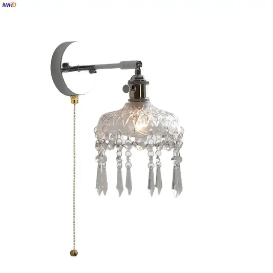 Modern crystal iron led wall light features a polished chrome arm with an intricately cut glass shade and dangling teardrops