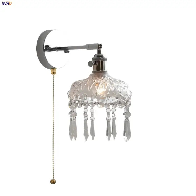 Modern crystal iron led wall light features a polished chrome arm with an intricately cut glass shade and dangling teardrops