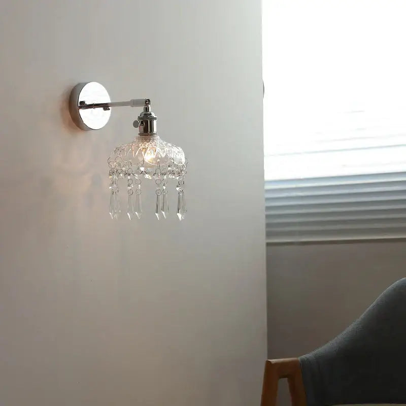 Modern crystal iron led wall light bedroom sconce with polished chrome finish and dangling clear glass beads decorbites crystal iron