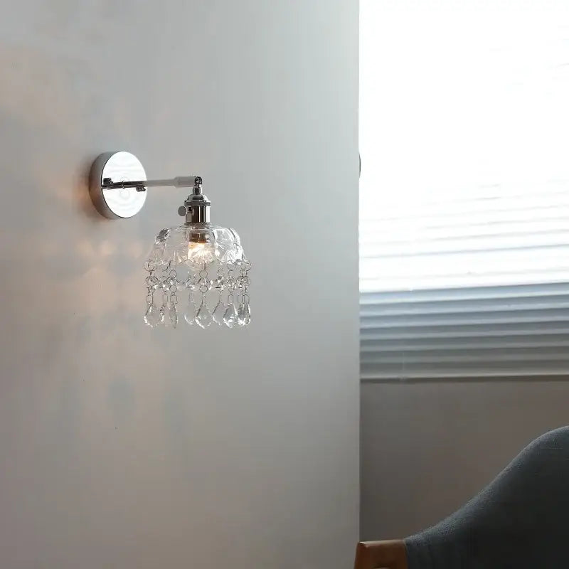 Modern crystal iron led wall light bedroom sconce with polished chrome finish and dangling teardrop crystals decorbites crystal iron