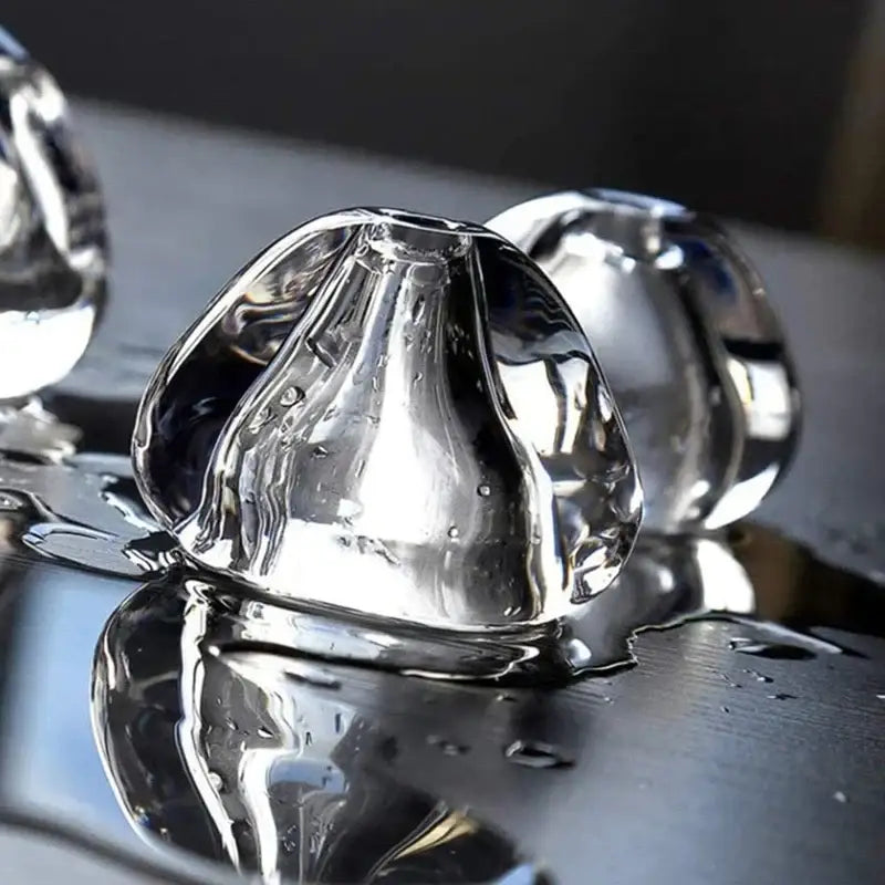 Modern crystal led ceiling chandeliers featuring clear glass globe pendant with smooth rounded edges and glossy finish