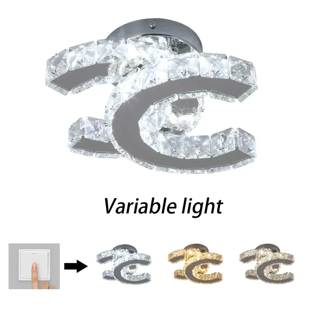 Modern crystal led ceiling lamp with chrome cc logo and clear crystal accents offering variable lighting decorbites crystal led