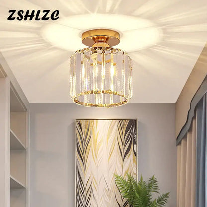 Gold-toned decorbites crystal led ceiling light with modern cylindrical design and clear faceted glass elements for kitchen
