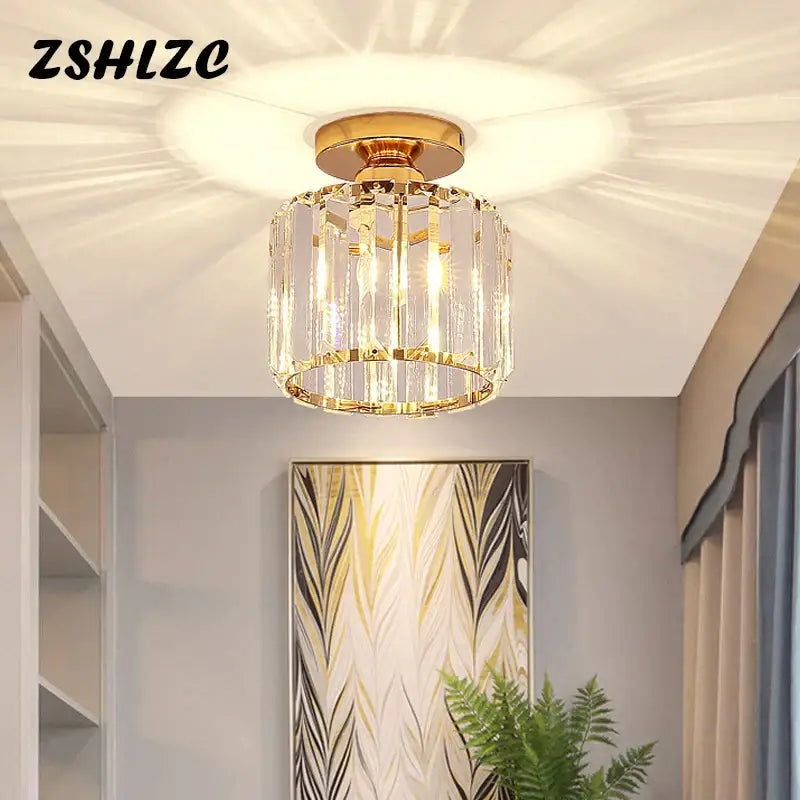 Gold-toned decorbites crystal led ceiling light with modern cylindrical design and clear faceted glass elements for kitchen