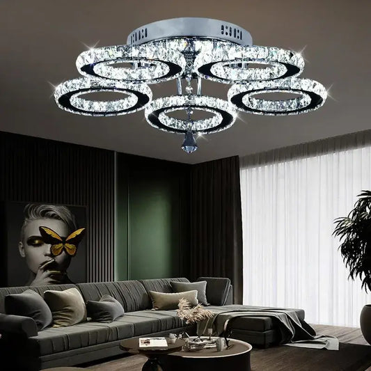 Modern crystal led ceiling light featuring multiple concentric rings and a central teardrop pendant for living rooms