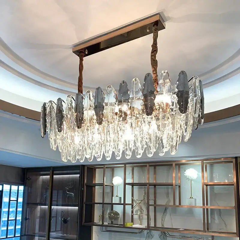 A modern decorbites crystal led chandelier with cascading clear and frosted glass prisms for dining room decor