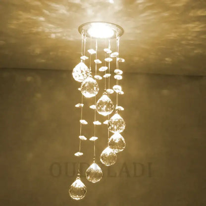 A modern crystal led downlight ceiling lamp with cascading teardrop glass pendants for living room decorbites crystal led