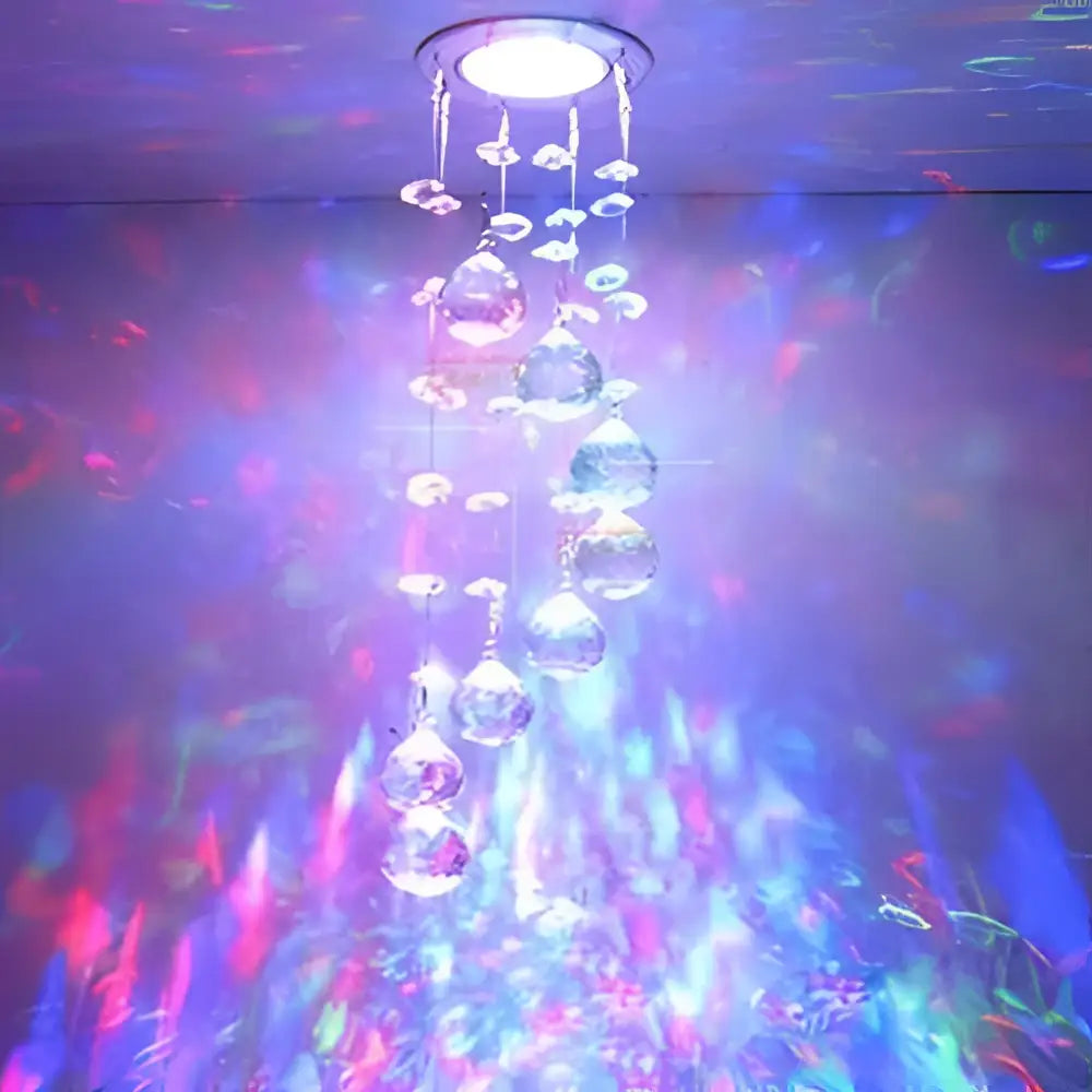 Modern crystal led downlight ceiling lamp with central light and dangling clear faceted glass orbs refracting colorful lights
