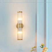 Modern crystal led gold wall sconce with vertical glass rods and warm glowing light for elegant decorbites crystal led decor