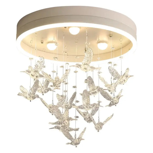 Modern crystal led hummingbird chandelier with clear translucent sculptures on a white base for bedroom ceiling light
