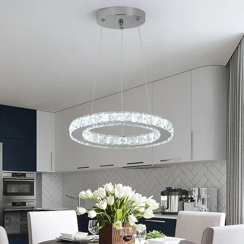Modern crystal led pendant chandelier with clear crystal accents and sleek chrome finish for dining room decorbites crystal led