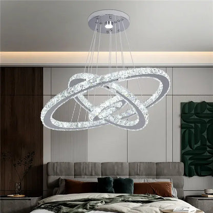Modern crystal led pendant double ring chandelier with interlocking crystal rings and sleek chrome ceiling mount for dining room decorbites crystal led