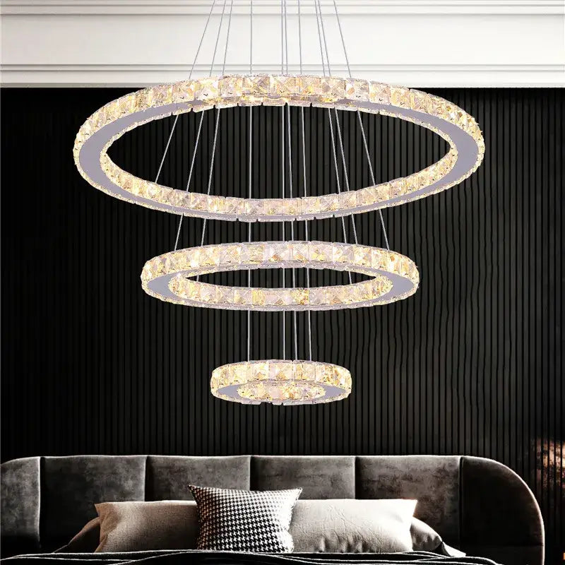 Modern crystal led pendant double ring chandelier featuring a three-tiered crystal led design with clear faceted crystals and silver frame