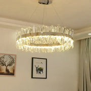A modern crystal led ring chandelier with metallic frame and clear crystals emitting warm light for luxury decorbites decor