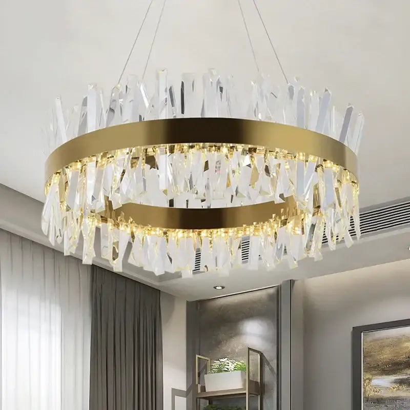 A modern crystal led ring chandelier with gold-toned metal frames and cascading clear crystal shards for luxury decorbites decor