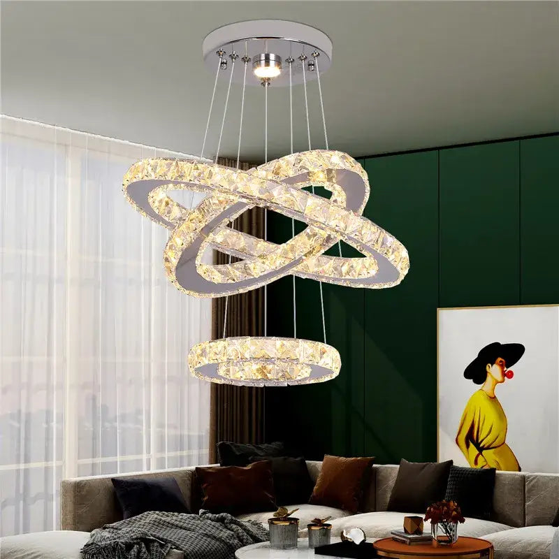 Modern crystal led ring pendant chandelier with interlocking chrome rings and clear faceted crystals for dining room decorbites crystal led