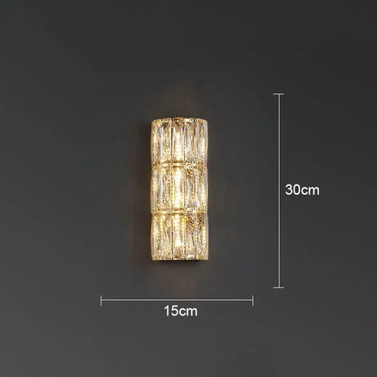 A sleek 30cm tall decorbites crystal led wall lamp with faceted crystal segments emitting warm light for living room decor