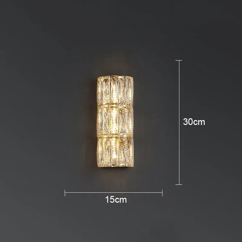 A sleek 30cm tall decorbites crystal led wall lamp with faceted crystal segments emitting warm light for living room decor
