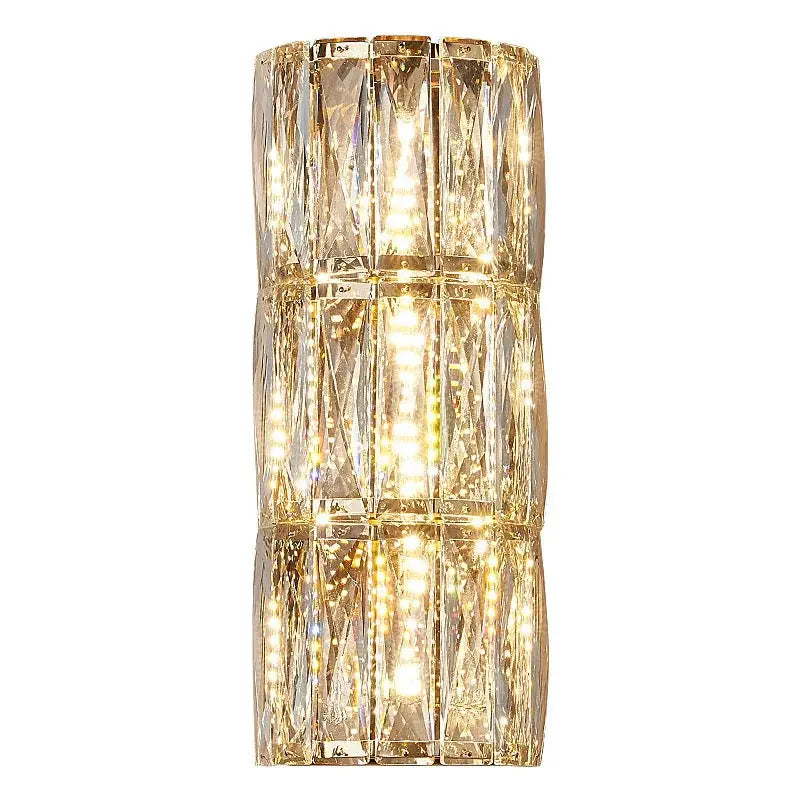 Modern gold-toned decorbites crystal led wall lamp with vertical facets and integrated lighting for living room decor