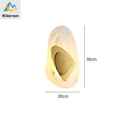 Modern crystal led wall lamp with bronze accent featuring a gold-toned glossy resin sculpture and concave cutout decorbites crystal led
