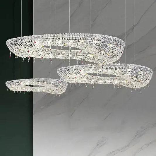 Three-tiered decorbites crystal oval chandelier with clear and red gemstone accents for modern living room decor