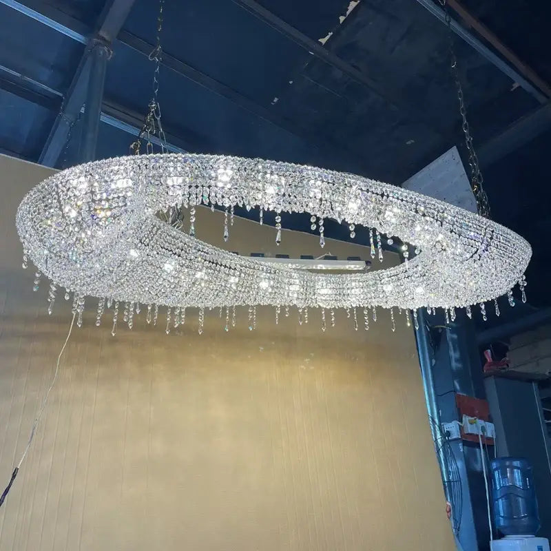 A dazzling decorbites crystal oval chandelier with clear crystal droplets for modern living room decor lighting