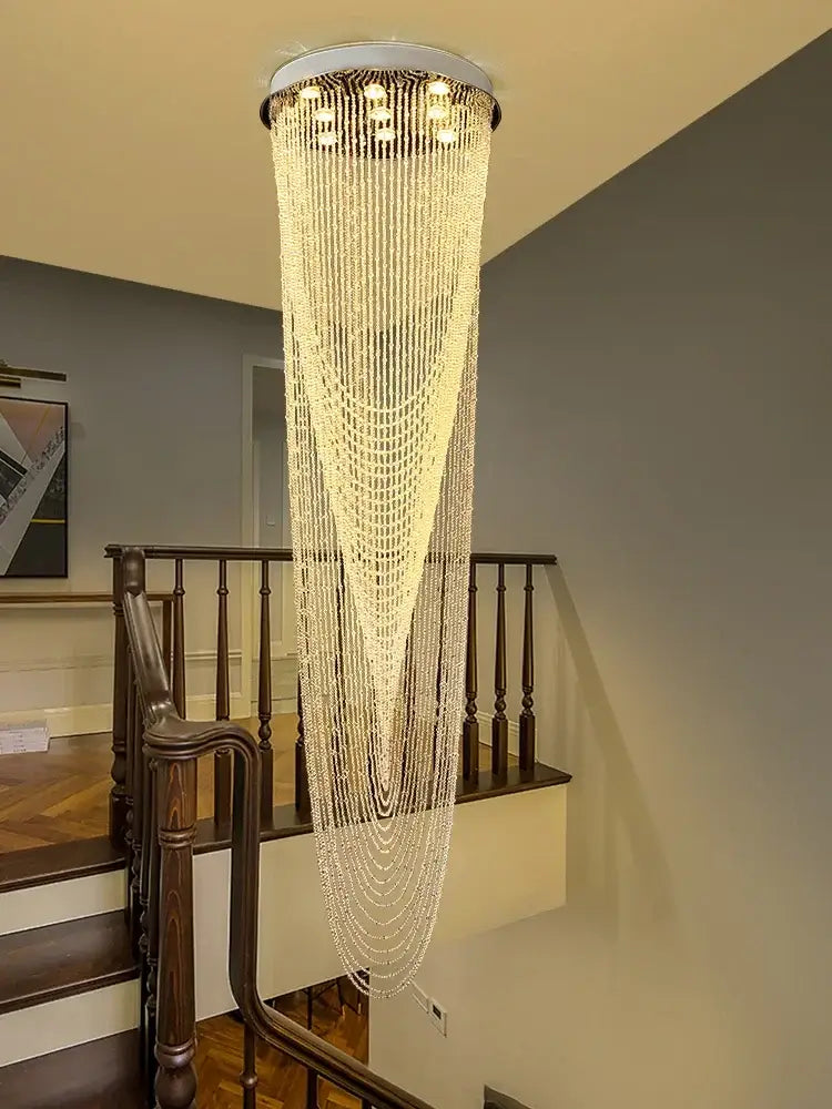 Modern crystal rotating chandelier with circular metallic top and clear crystal beads for elegant living room decorbites crystal rotating light