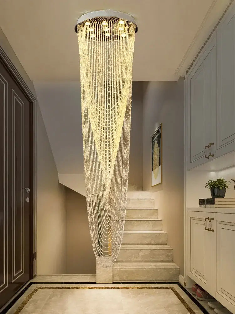 Modern decorbites crystal rotating chandelier with cascading clear faceted beads emitting warm light for living room decor