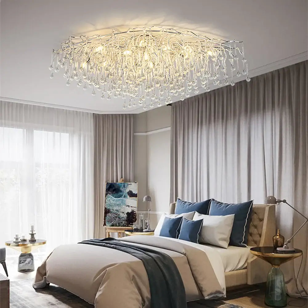 Modern crystal teardrop gold chandelier with intricate crystal droplets and a metallic frame for elegant living room decorbites