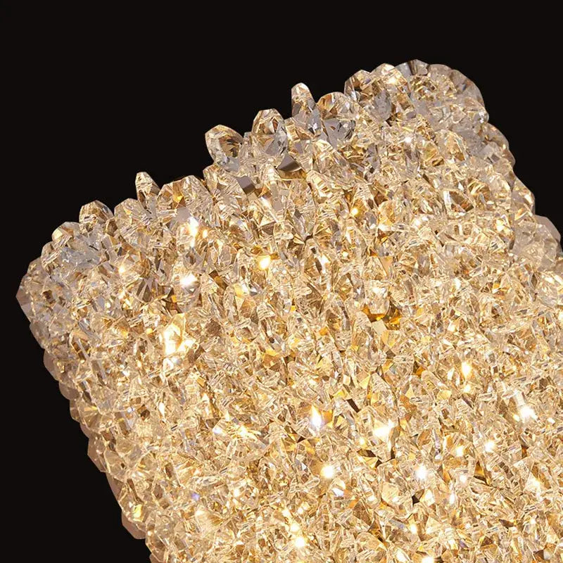 A modern crystal wall lamp with a dazzling cluster of golden-hued faceted crystals for elegant decorbites crystal wall lighting