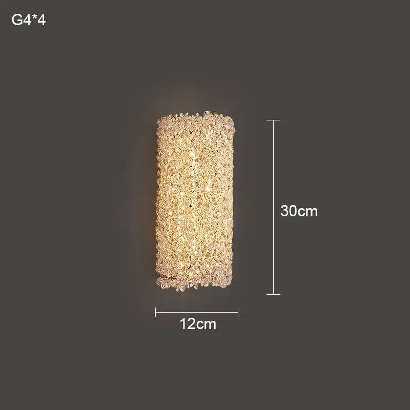 Modern crystal wall lamp featuring a rectangular gold sconce with clear and amber decorbites crystal wall elements