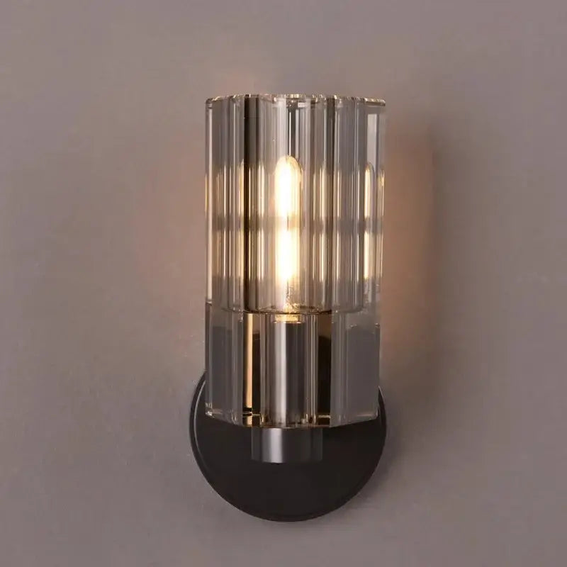 Modern crystal wall lamp with cylindrical ridged glass shade and brushed gold and black metal base for bedroom decorbites crystal wall lamp