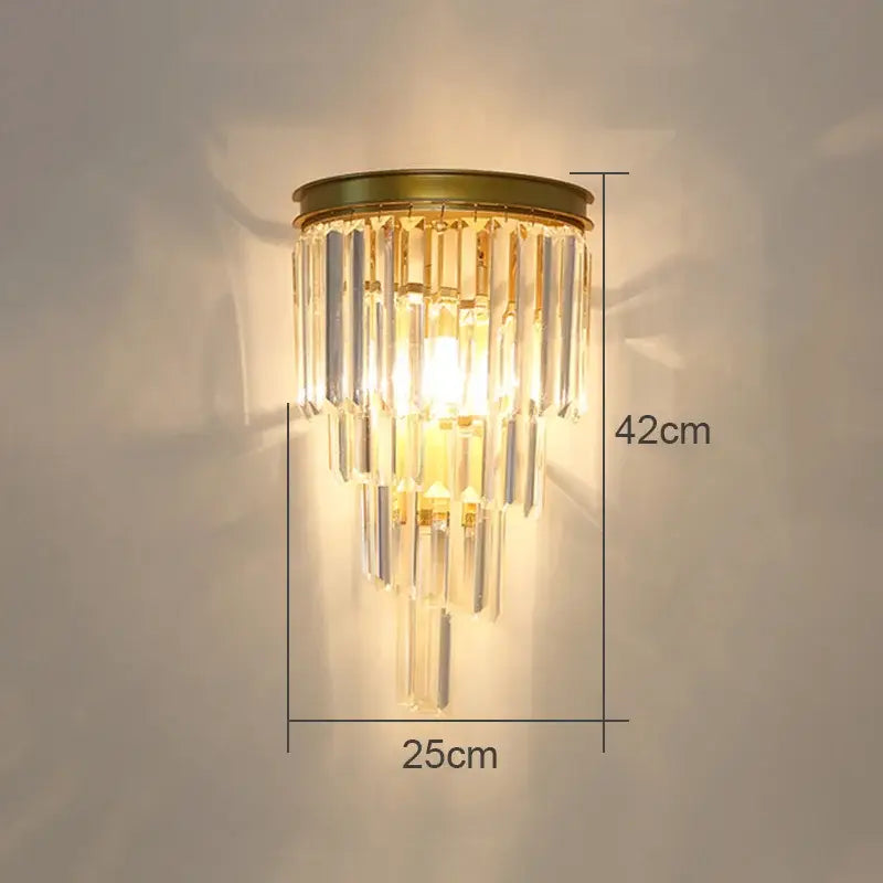 A golden modern crystal wall lamp with clear cascading prisms for living room decorbites crystal wall lamp
