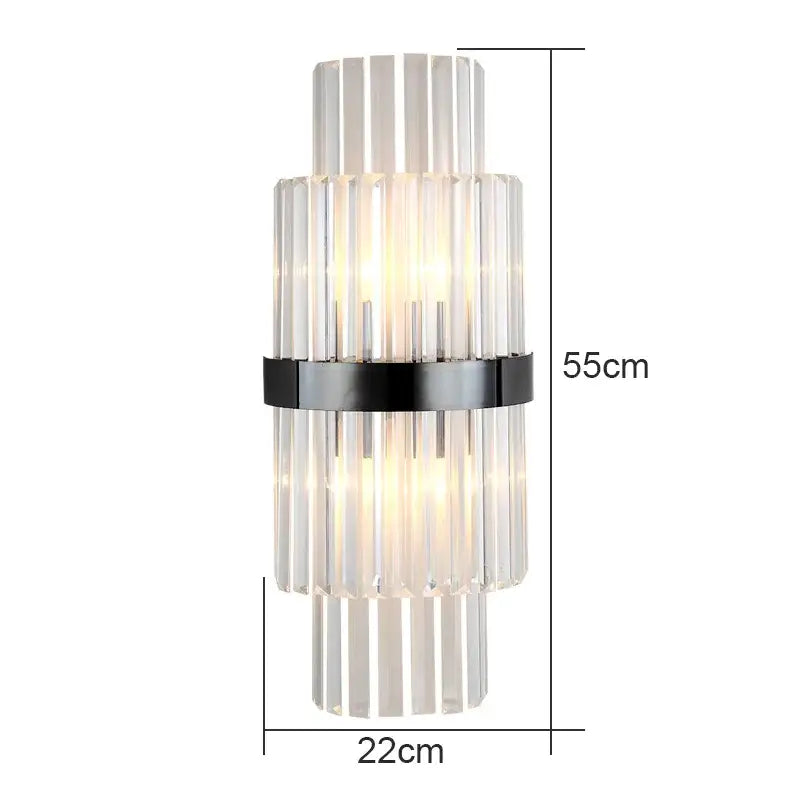 Modern crystal wall lamp with stacked clear crystal rods and black metal band illuminated by warm light for living room decorbites wall lamp
