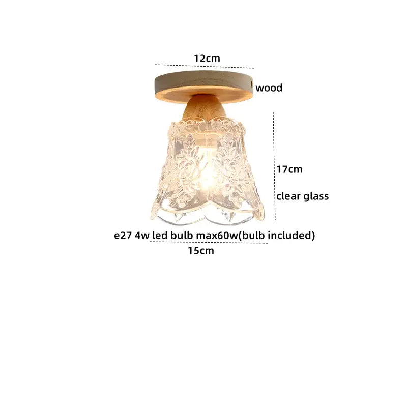 A delicate modern crystal wood led ceiling lamp with a clear glass floral etched shade and warm wooden base