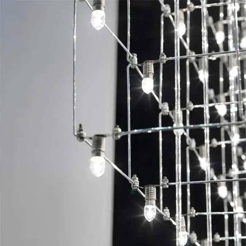 Modern cube led chandelier featuring polished chrome geometric grid and clear led bulbs for luxury decorbites cube led use