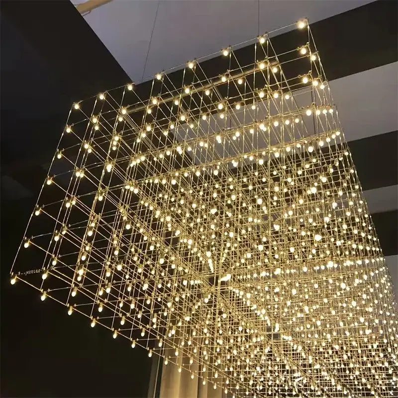 Modern cube led chandelier by decorbites features a golden cube frame with a grid of glowing bulbs for luxury decor